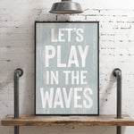a picture of a sign that says let&#39;s play in the waves