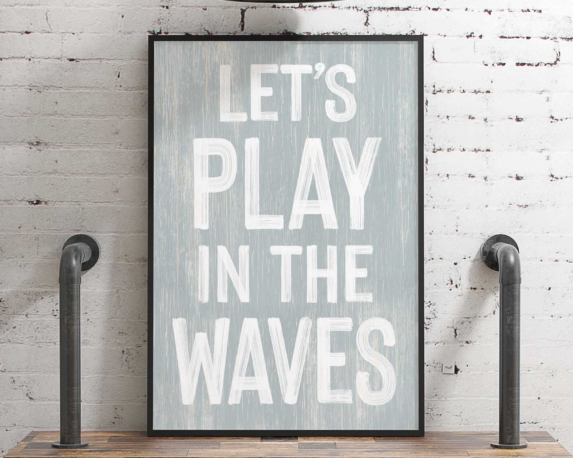 a picture of a sign that says let's play in the waves