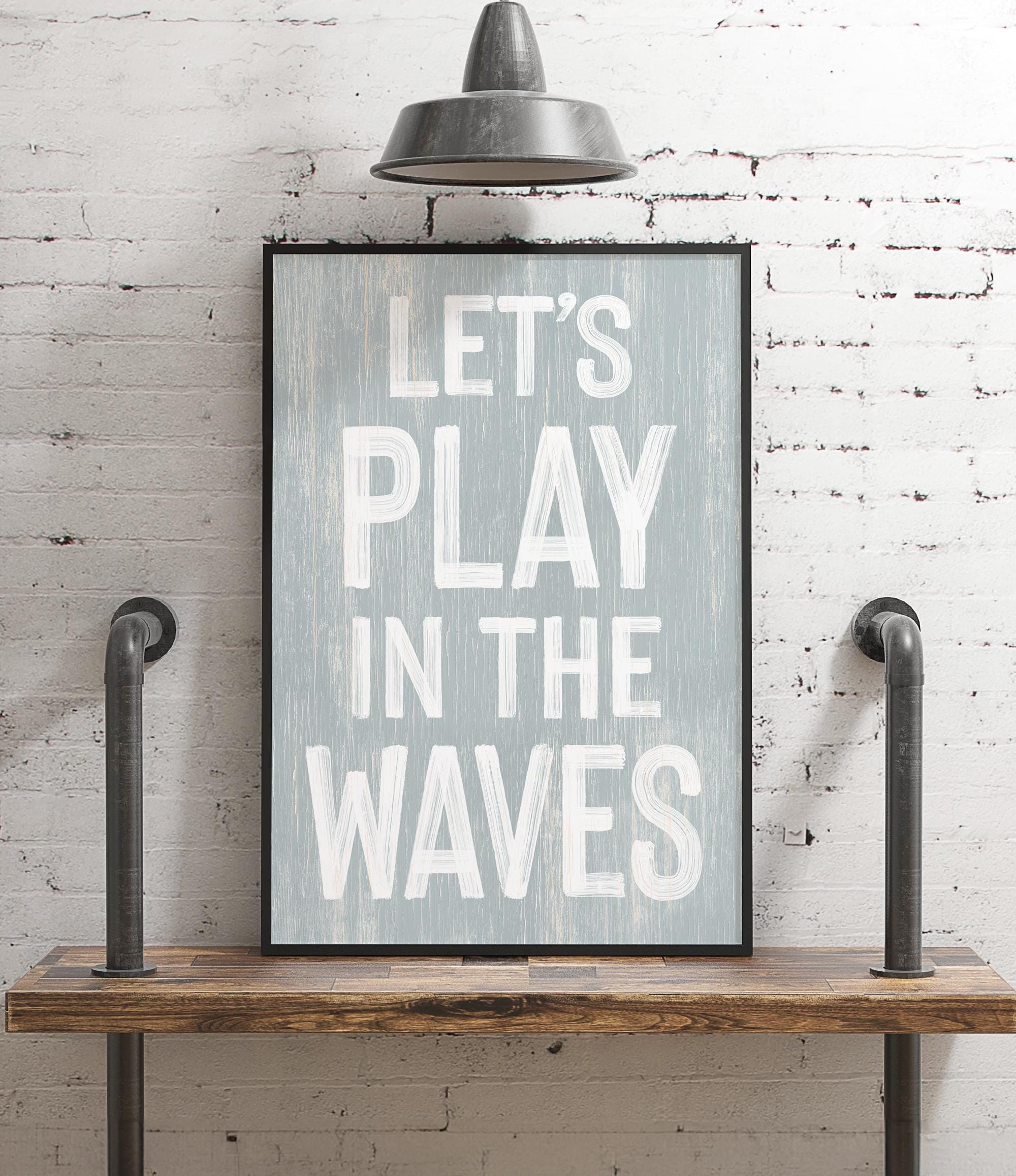 a picture of a sign that says let&#39;s play in the waves