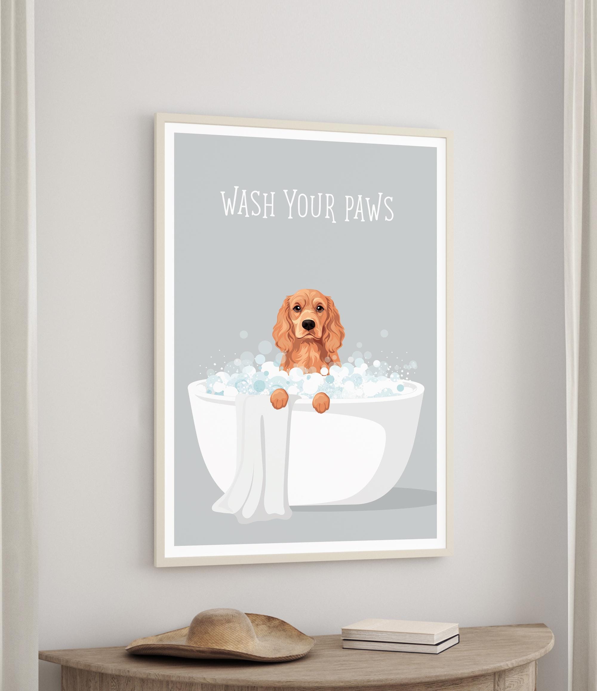 A framed poster with a dog sitting in a bathtub filled with bubbles, accompanied by the text "WASH YOUR PAWS".