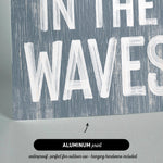 there is a sign that says in the waves