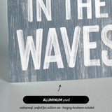 there is a sign that says in the waves
