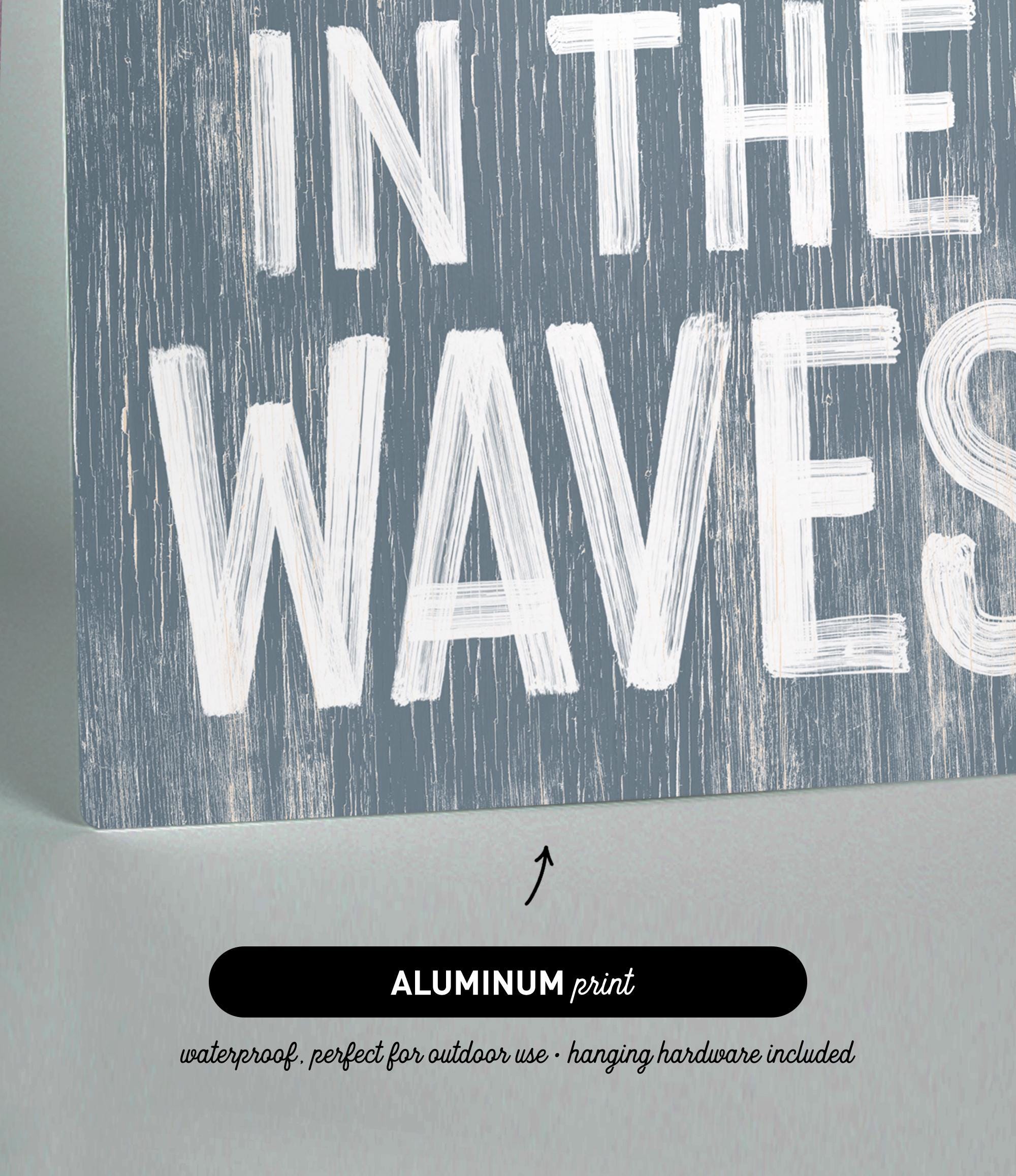 there is a sign that says in the waves