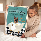 a woman holding a poster of a german shepherd in a bathtub