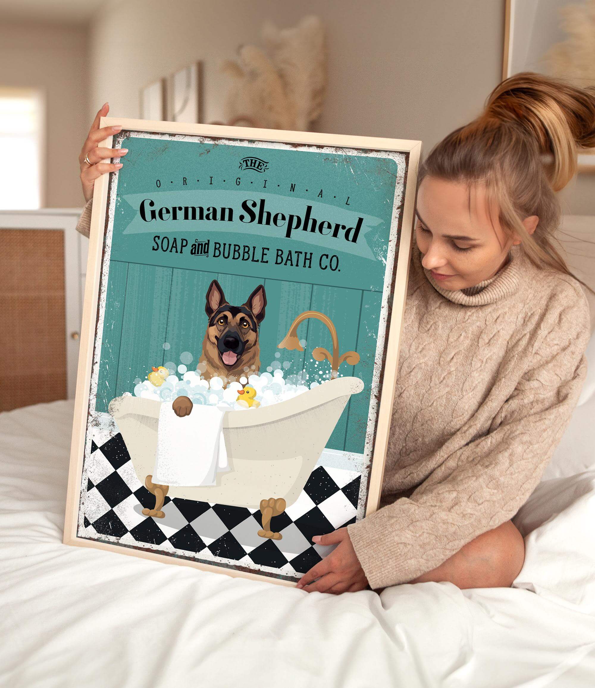 a woman holding a poster of a german shepherd in a bathtub