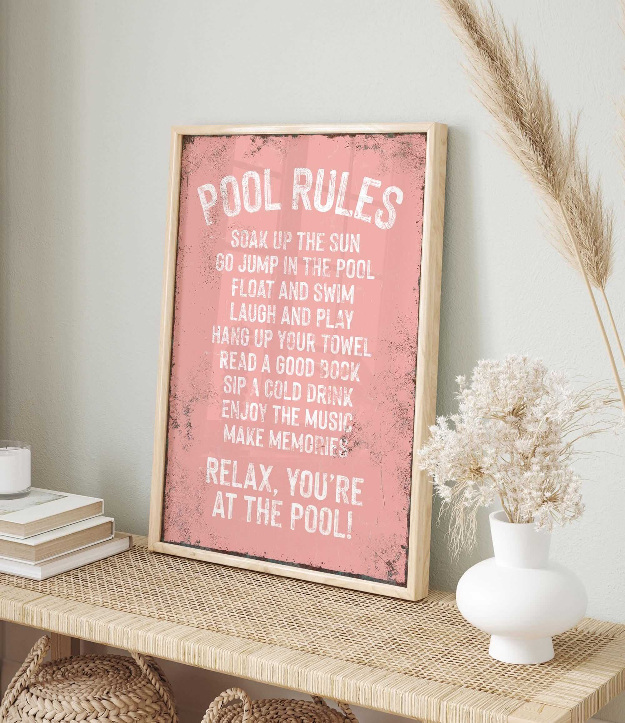 a picture of a pink poster on a shelf
