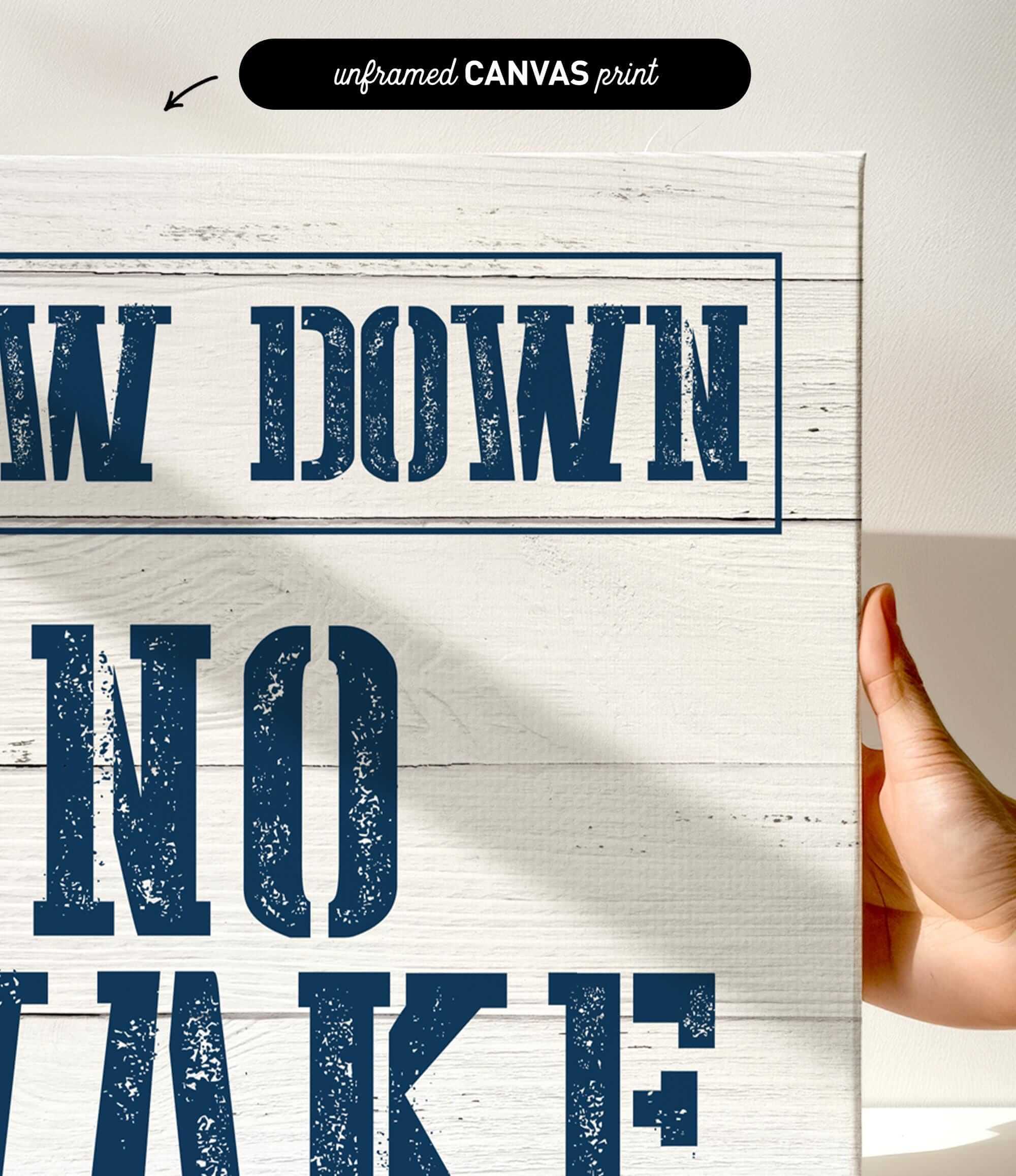 a hand holding a sign that says draw down no wake