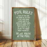 a pool rules sign sitting on top of a wooden floor