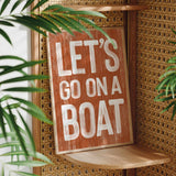 a wooden sign that says let&#39;s go on a boat