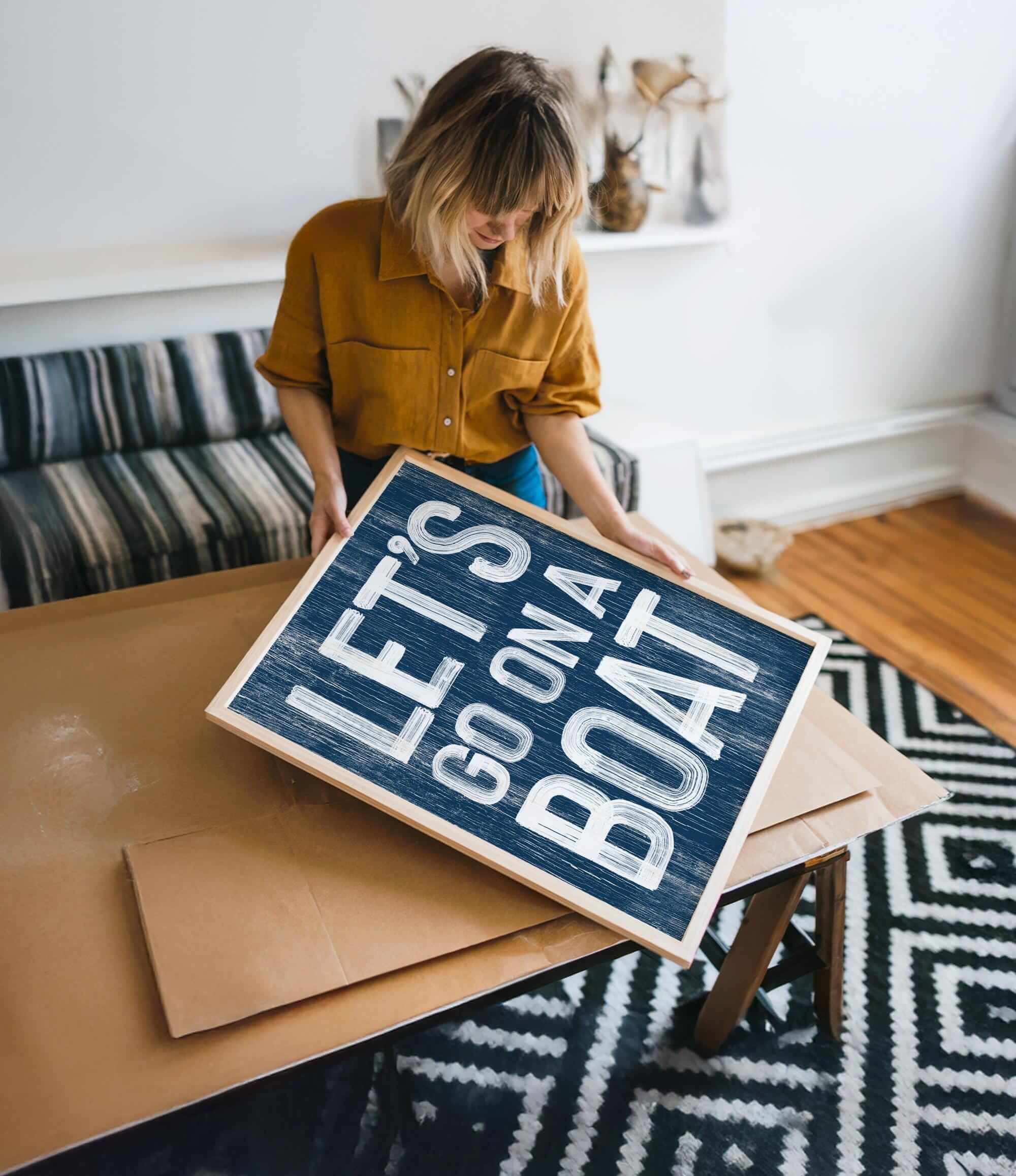 a woman holding a sign that says life is not a box
