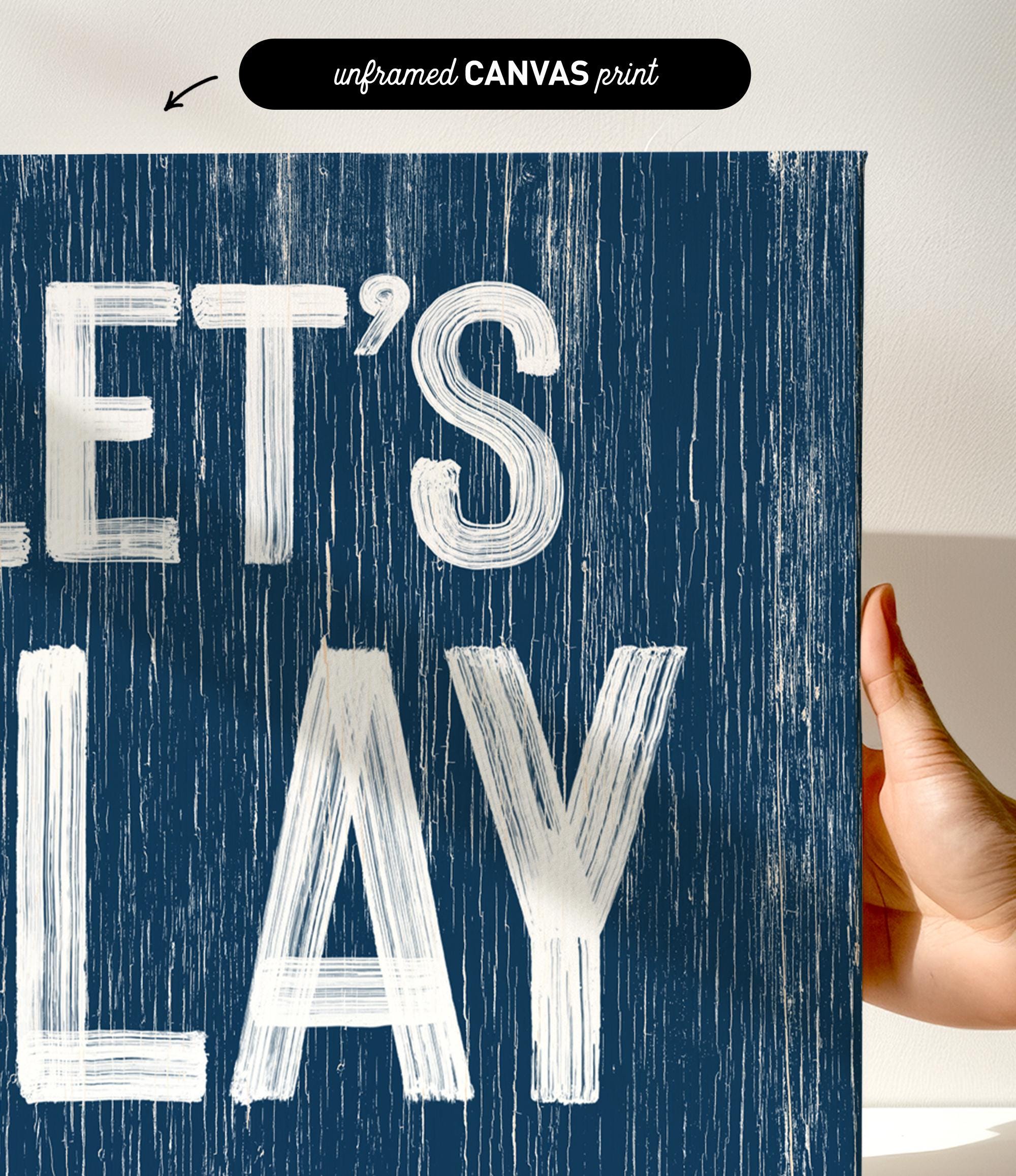 a hand holding a sign that says let&#39;s play