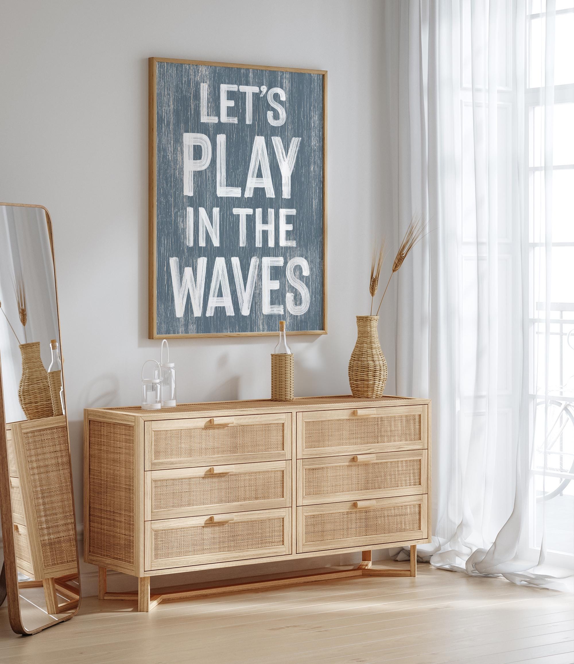 a picture of a room with a dresser and a mirror