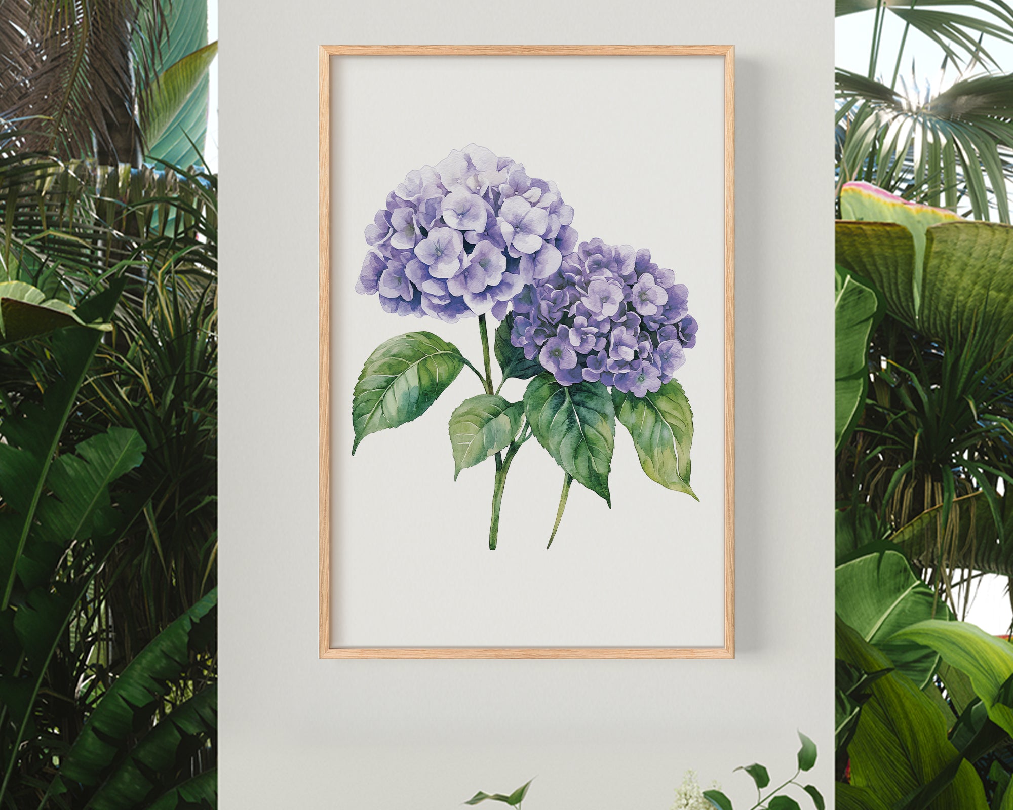 a framed watercolor painting of purple hydrangeas hanging on a wall, surrounded by lush greenery and tropical plants.