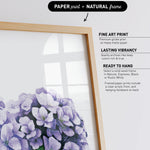 a framed print of a bouquet of purple flowers, with a natural frame.