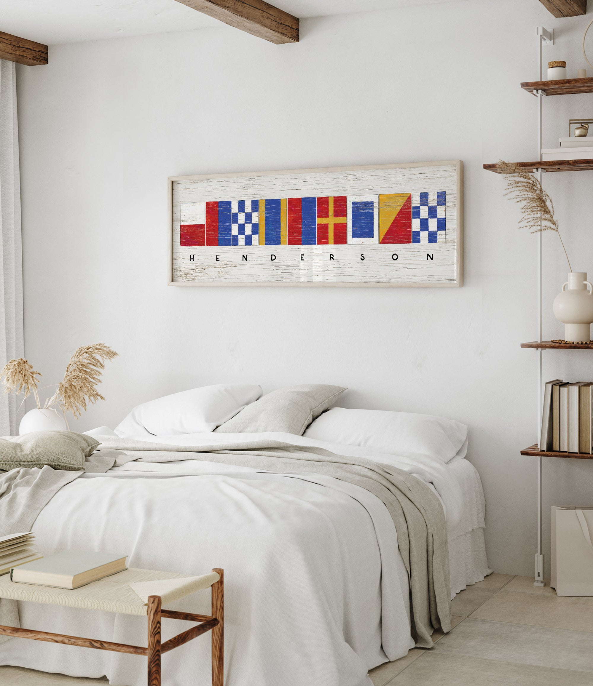 a bedroom with a white bed and a painting on the wall