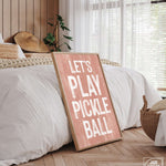 a wooden sign that says let's play pickle ball