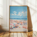 The image is a framed painting depicting a beach scene with people enjoying the sun and sand.