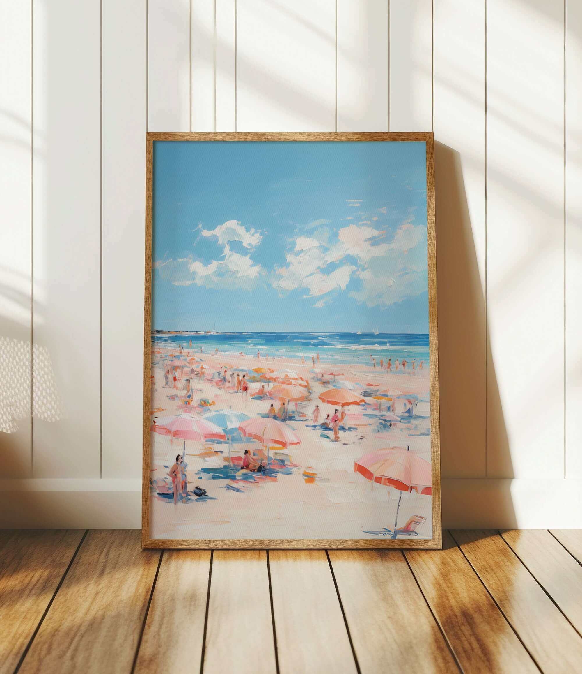 The image is a framed painting depicting a beach scene with people enjoying the sun and sand.
