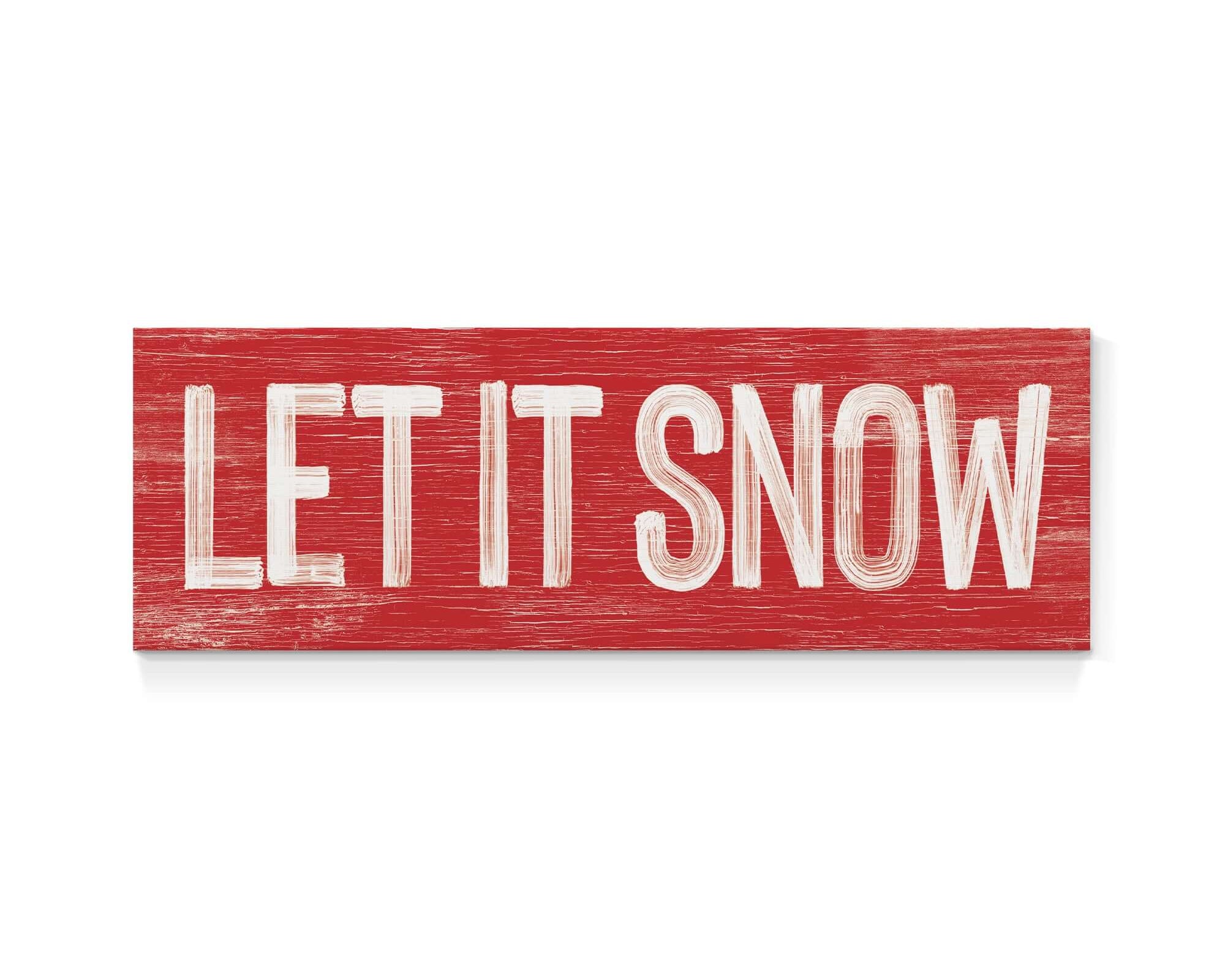 a wooden sign that says let it snow