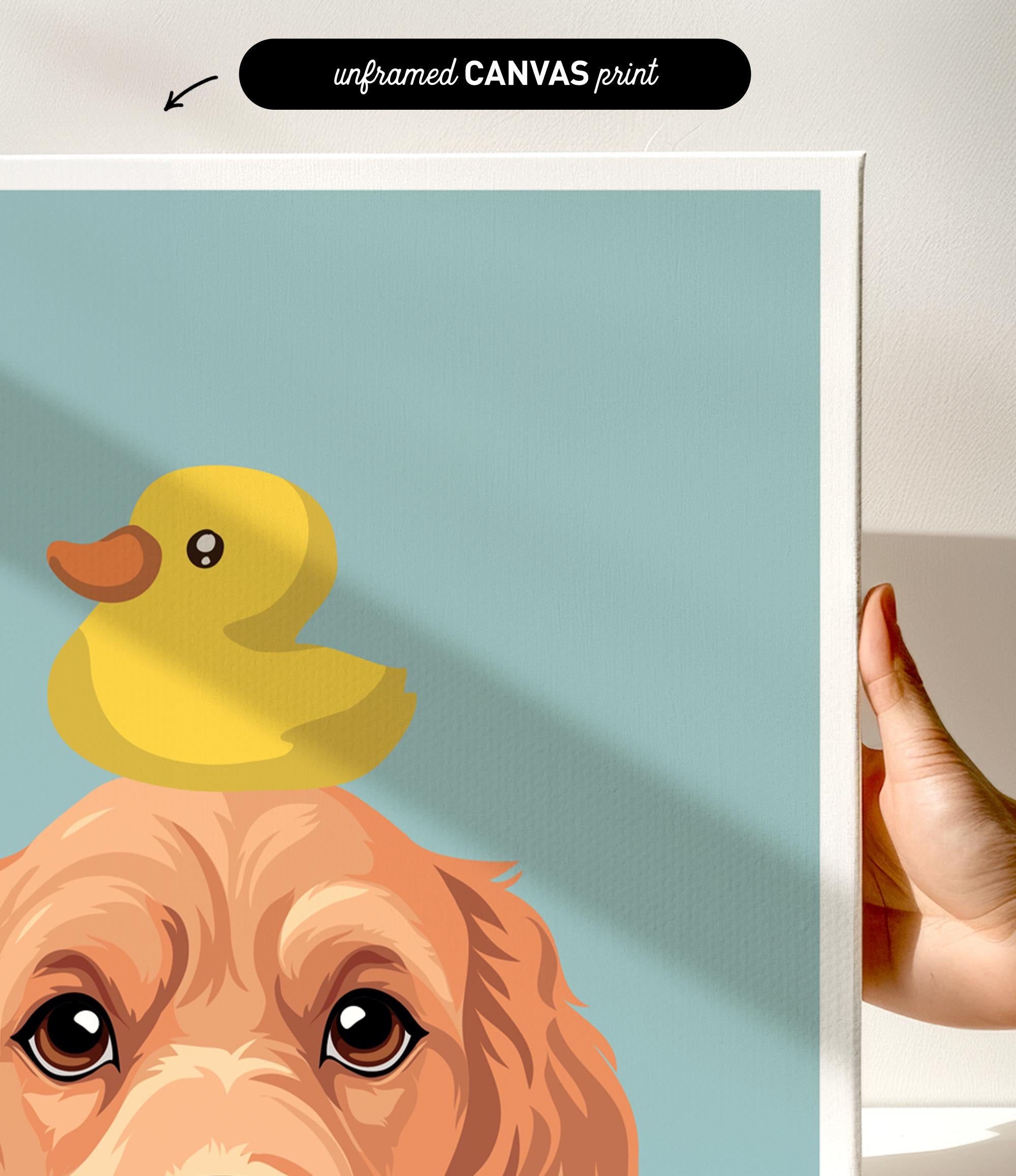 a person holding a framed print of a cartoon image depicting a duck sitting on a dog's head.
