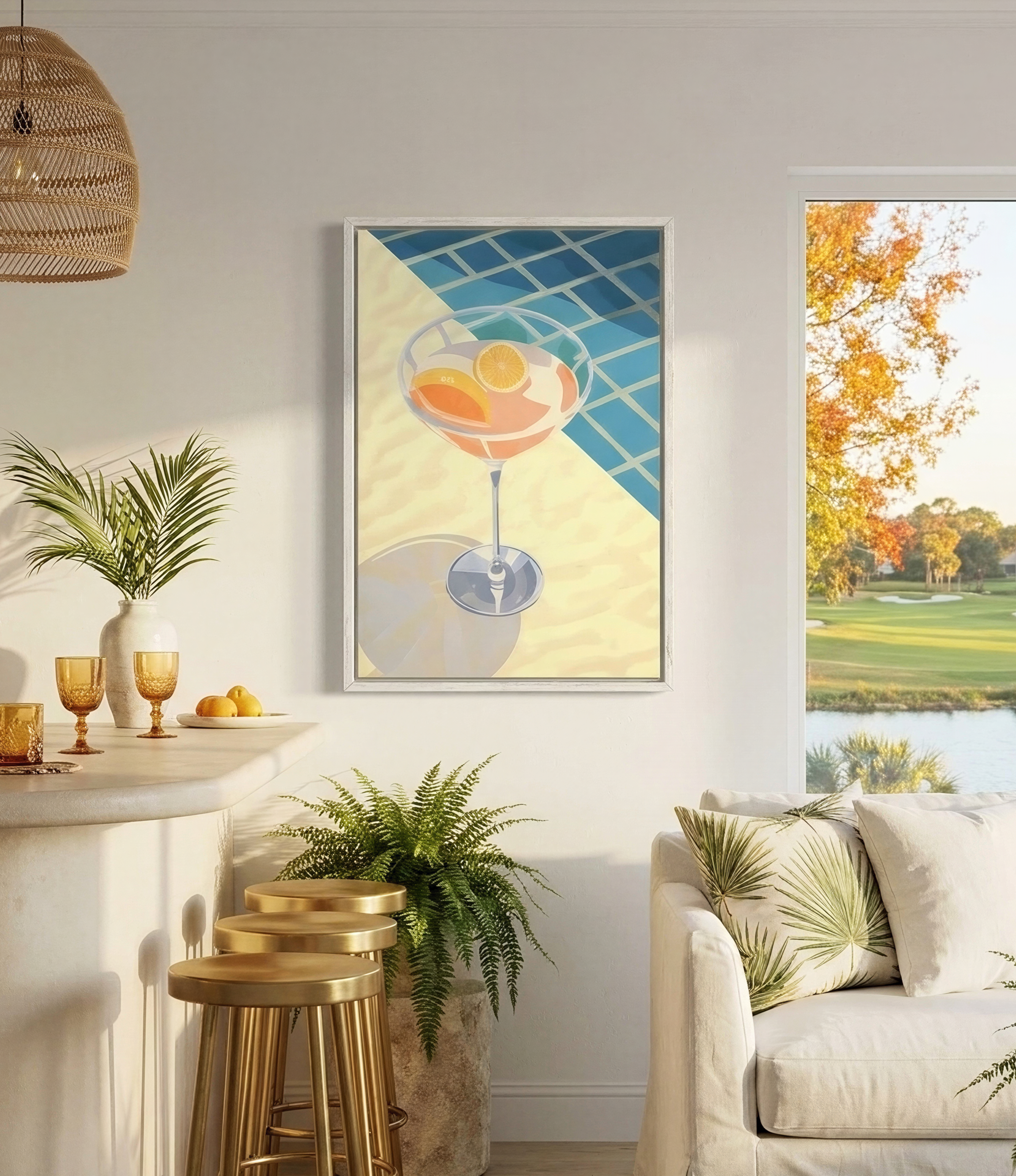 a cozy living room with a white sofa, a bar with stools, and a large window overlooking a scenic outdoor view. The room is decorated with potted plants, a hanging light fixture, and a framed artwork featuring a cocktail glass with fruit.