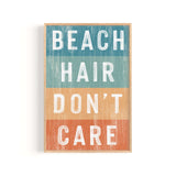 a wooden sign that says beach hair don't care