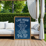 A sign on a wooden deck with a scenic view of a lake, featuring a list of rules for visitors to follow while relaxing at the lake house.