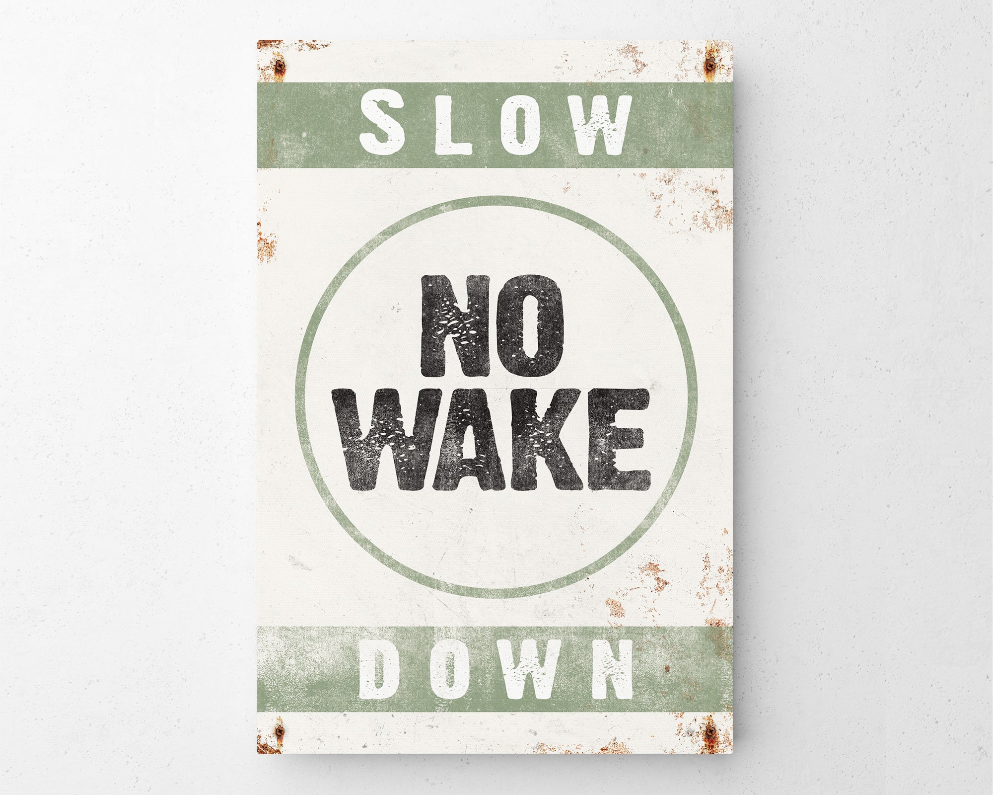 a sign that says slow no wake down