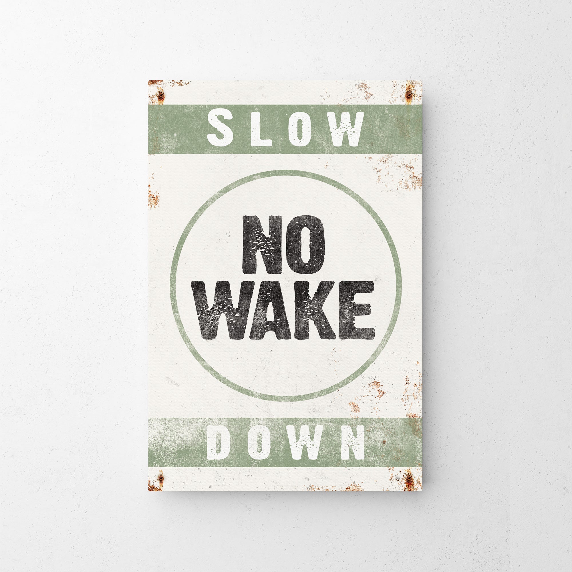a sign that says slow no wake down