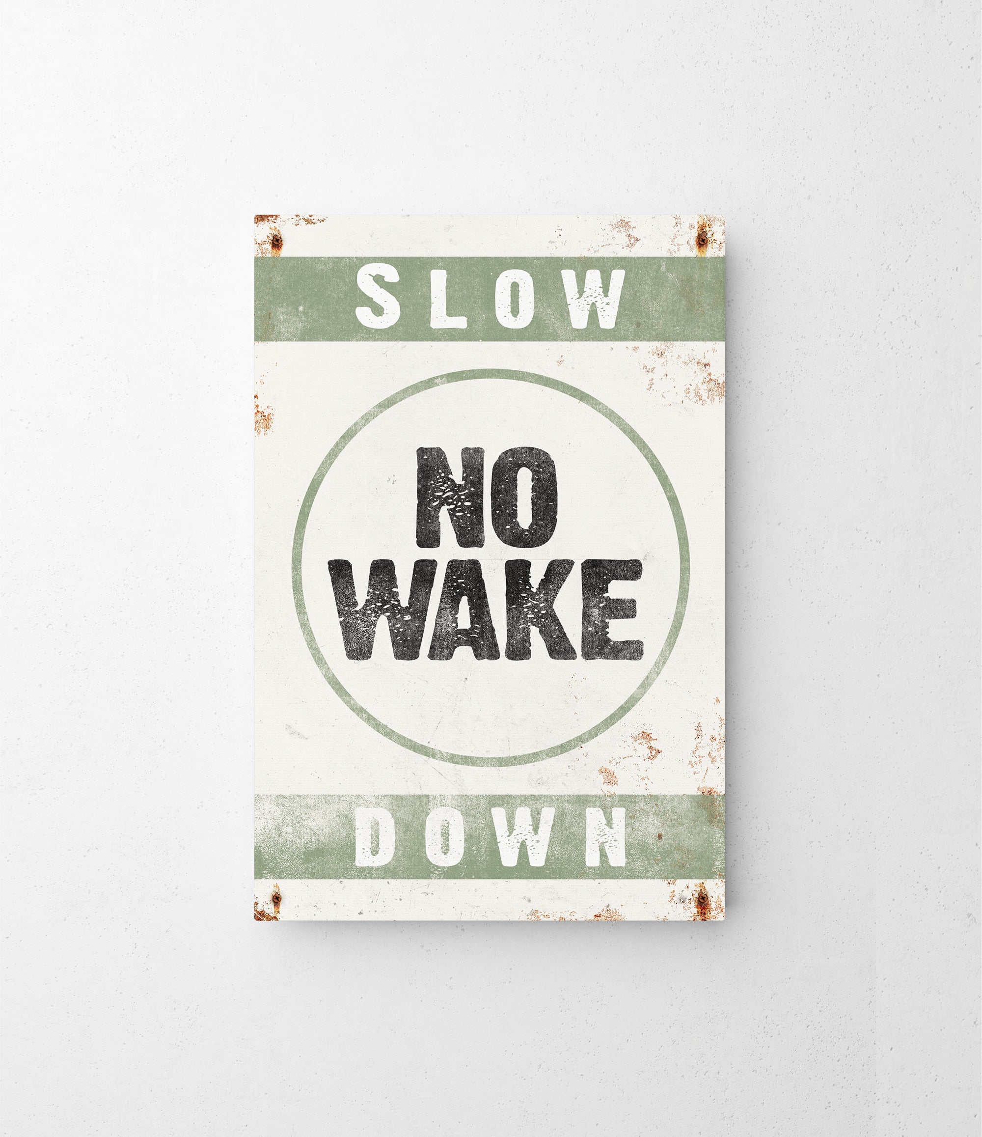 a sign that says slow no wake down