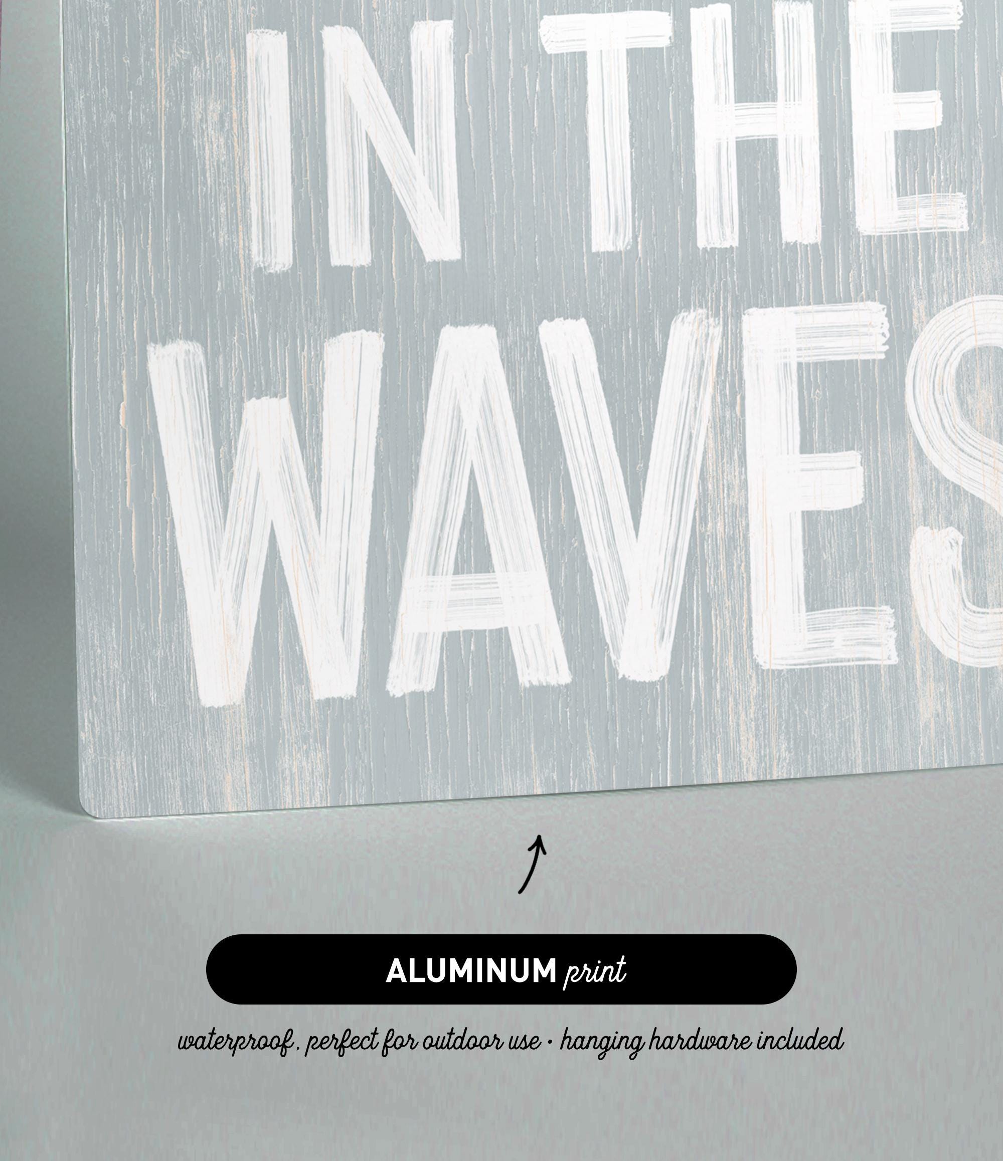 a wooden sign that says in the waves