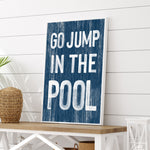 a sign that says go jump in the pool