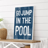 a sign that says go jump in the pool