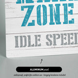 a sign that reads wake zone idle speed