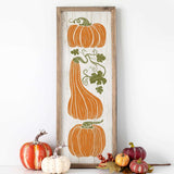 a picture of pumpkins and gourds on a shelf