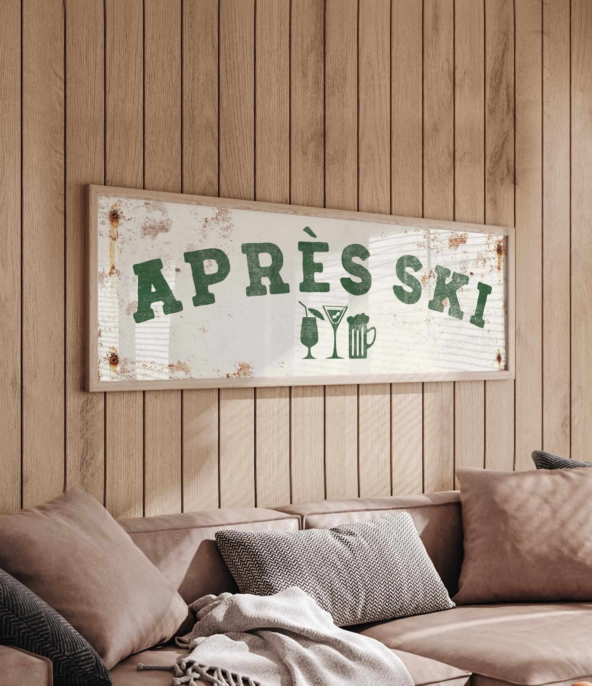 a wooden wall with a framed sign that reads "APRÈS SKI", accompanied by a beer mug and a wine glass icon.