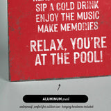 a picture of a red sign that says relax you&#39;re at the pool