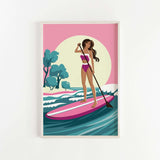 A woman in a pink and white swimsuit is paddleboarding on a pink surfboard, with a sunset and trees in the background.