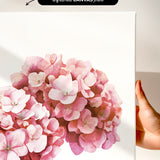 a close-up of a beautiful arrangement of pink flowers against a white background.