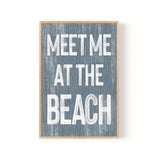 a sign that says meet me at the beach