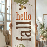 a person holding up a sign with a picture of a pumpkin