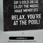 a black and white picture of a sign that says relax you&#39;re at the