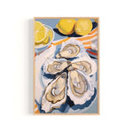 A framed painting depicting a close-up view of several oysters on a plate, with a lemon slice and two lemons in the background.