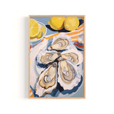 A framed painting depicting a close-up view of several oysters on a plate, with a lemon slice and two lemons in the background.