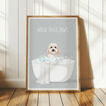 A framed poster with a cute dog sitting in a bathtub filled with bubbles, accompanied by the text "WASH YOUR PAWS".