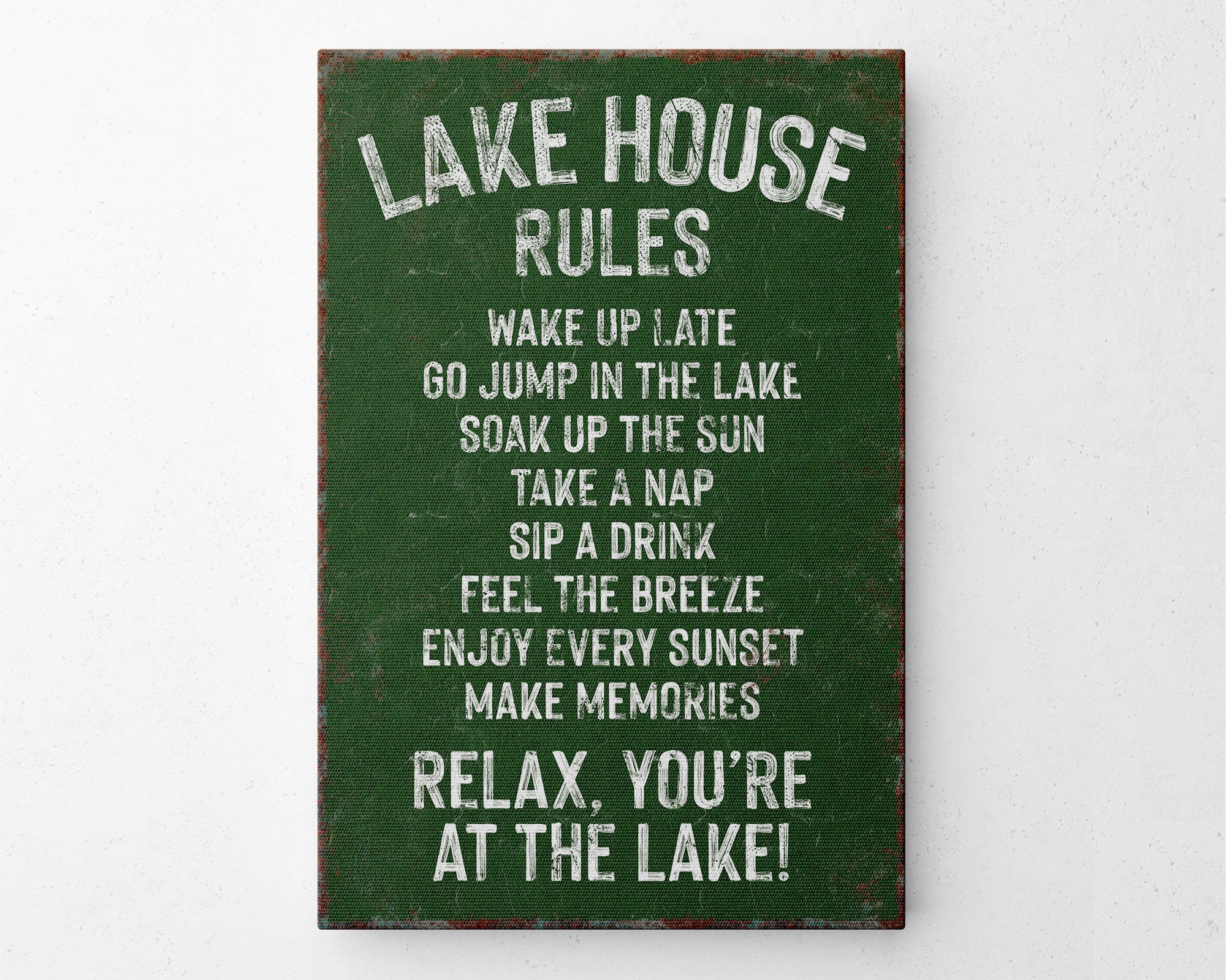 a sign on a wall that says lake house rules
