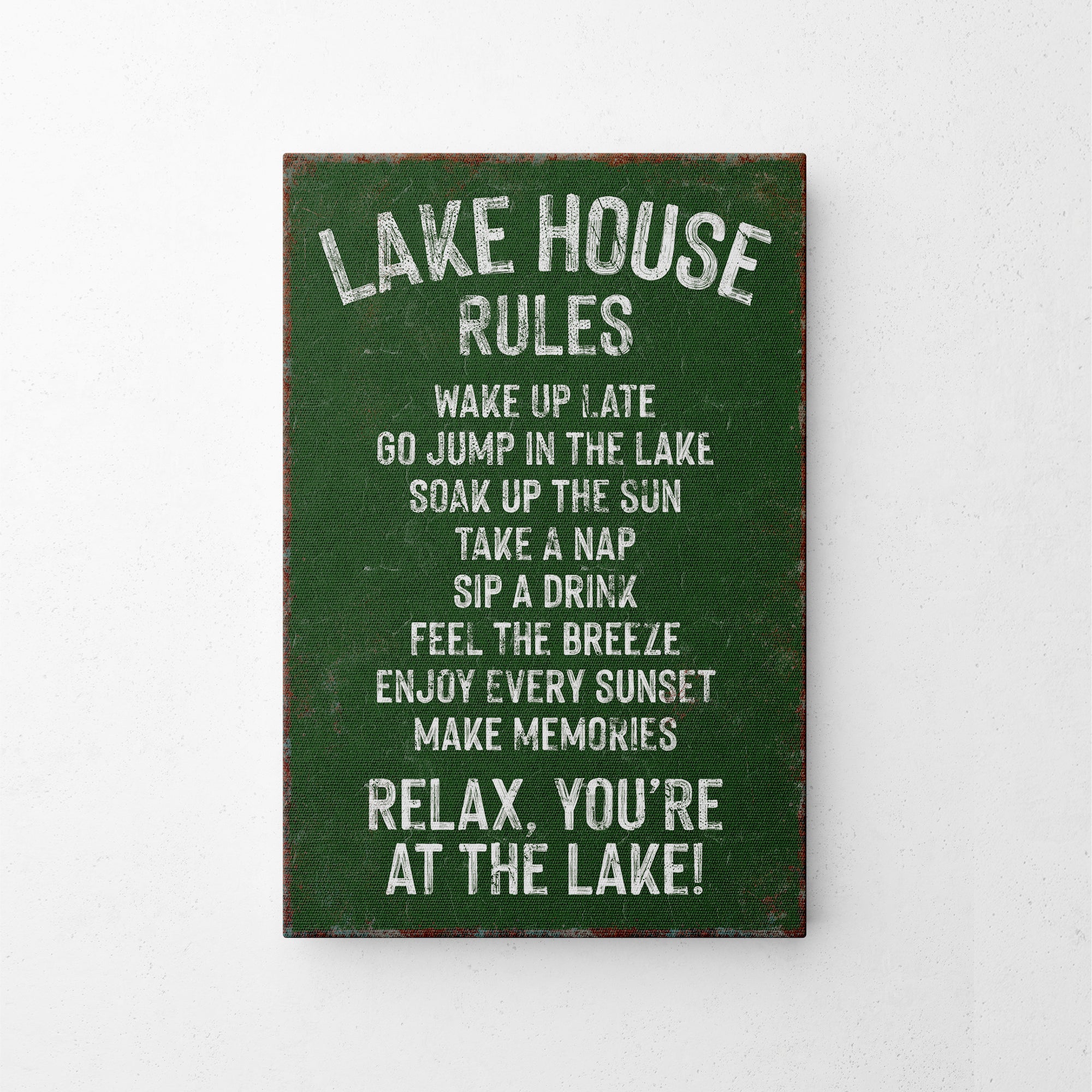 a sign on a wall that says lake house rules