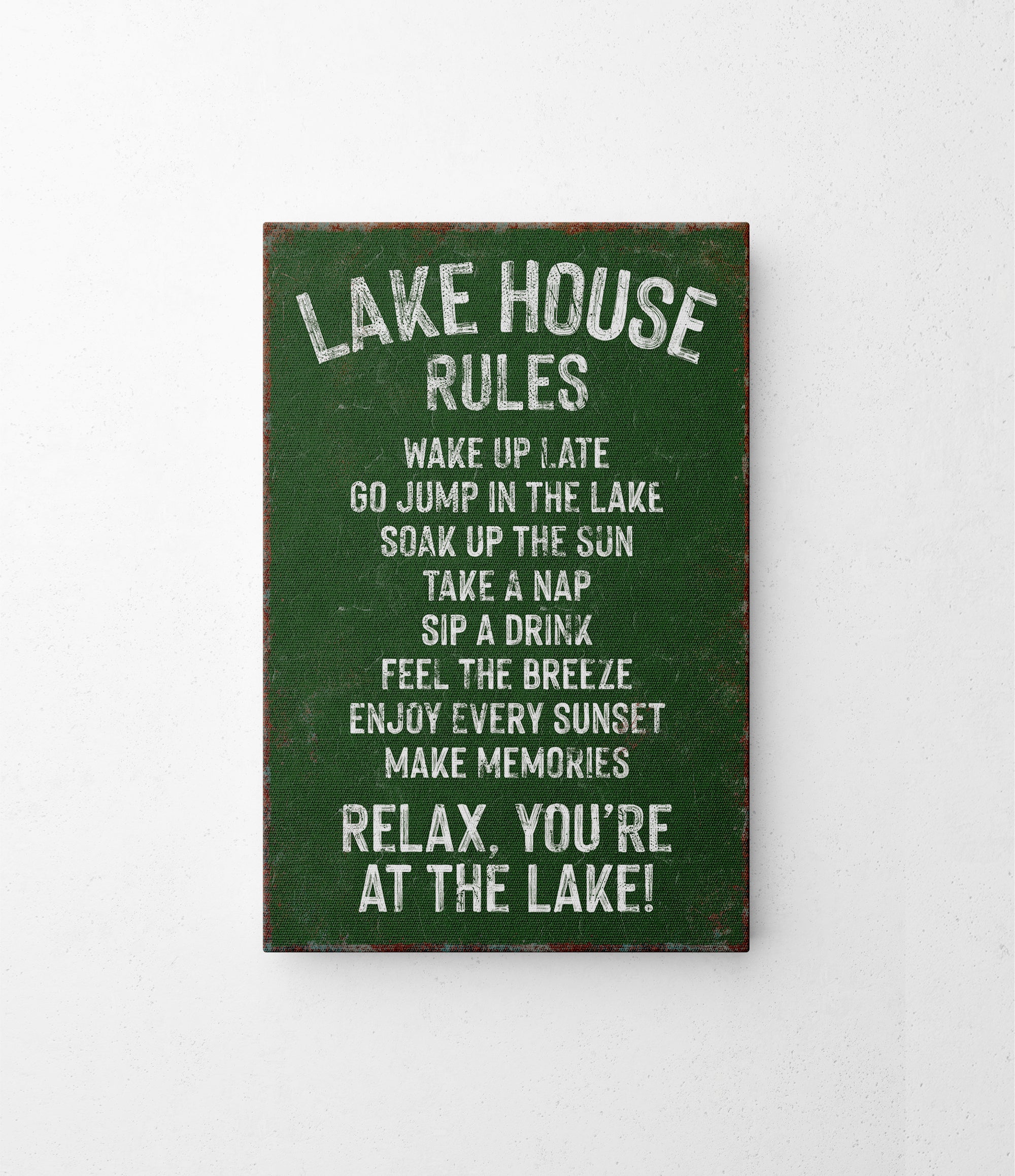 a sign on a wall that says lake house rules