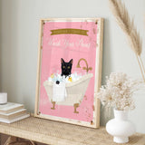 A framed poster with a black cat sitting in a bathtub filled with bubbles, accompanied by a pink background and a banner that reads "Please don't forget to wash your pans".