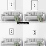 Comparison of four poster sizes above a gray loveseat with a green blanket, showing how the NO WAKE Sailboat Sunset Sign can enhance modern living rooms as vintage wall art or lake house decor.